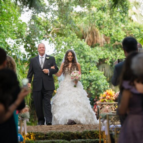Stephanie&PJ_Wedding-282 A bride with a flower bouquet enter in the wedding ceremony space with her groom